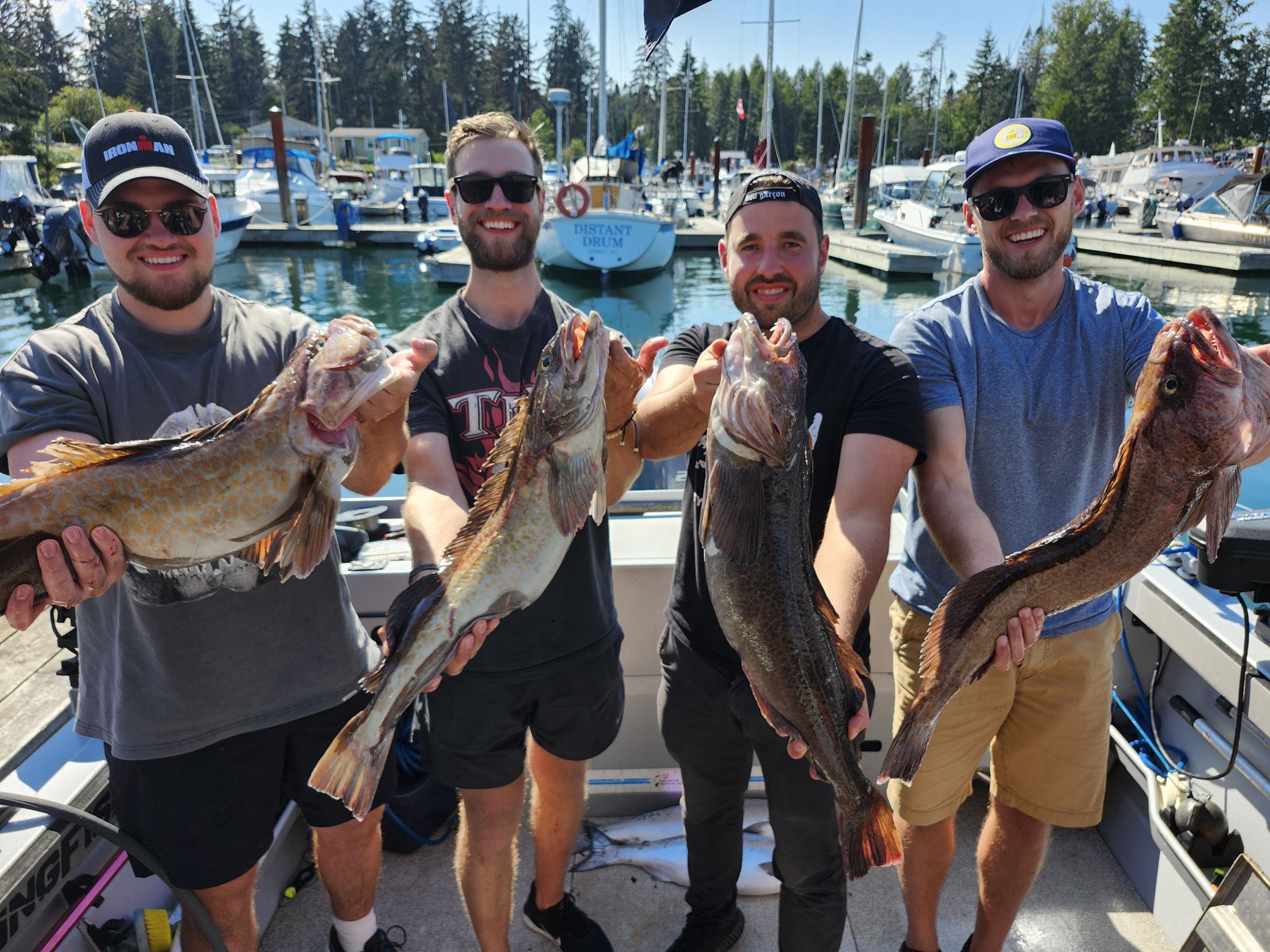 A group of men pose with lingcod