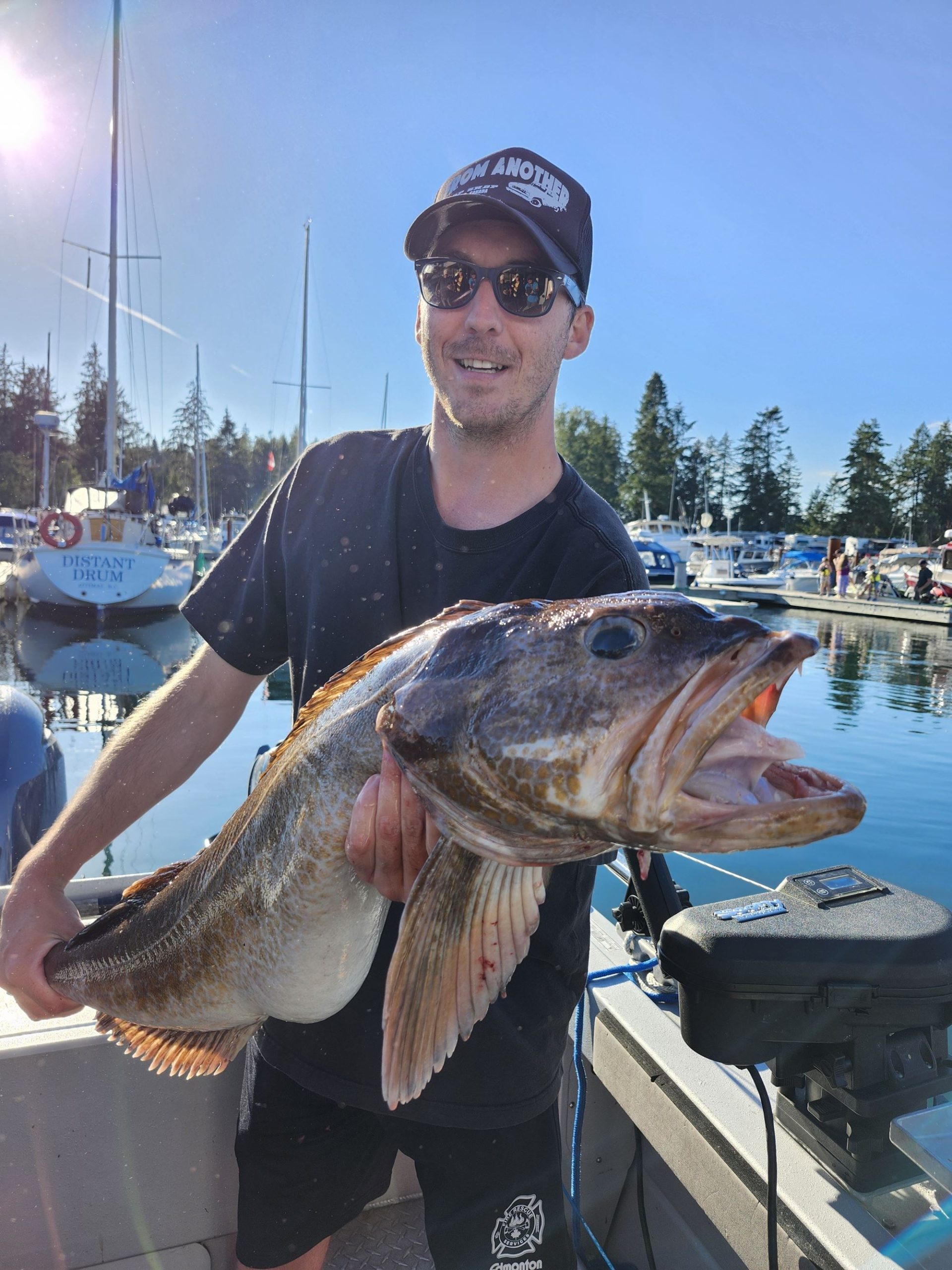 A man holds his lingcod