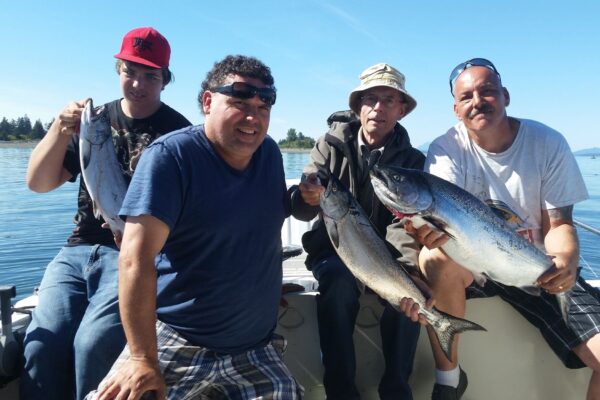 SLABRADOR-SALMON-CHARTERS-Gallery5 A group of men pose with their catches of the day